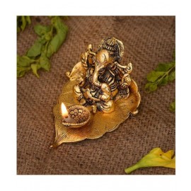 HOMETALES Leaf Ganesha with deepak Decorative Showpiece - 7 cm  (Aluminium, Gold) HOMETALES Leaf Ganesha with deepak Decorative Showpiece - 7 cm  (Aluminium, Gold)