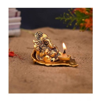 HOMETALES Leaf Ganesha with deepak Decorative Showpiece - 7 cm  (Aluminium, Gold)